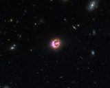 Multiple images of a distant quasar known as RX J1131-1231 are visible in this combined view. Image: NASA.